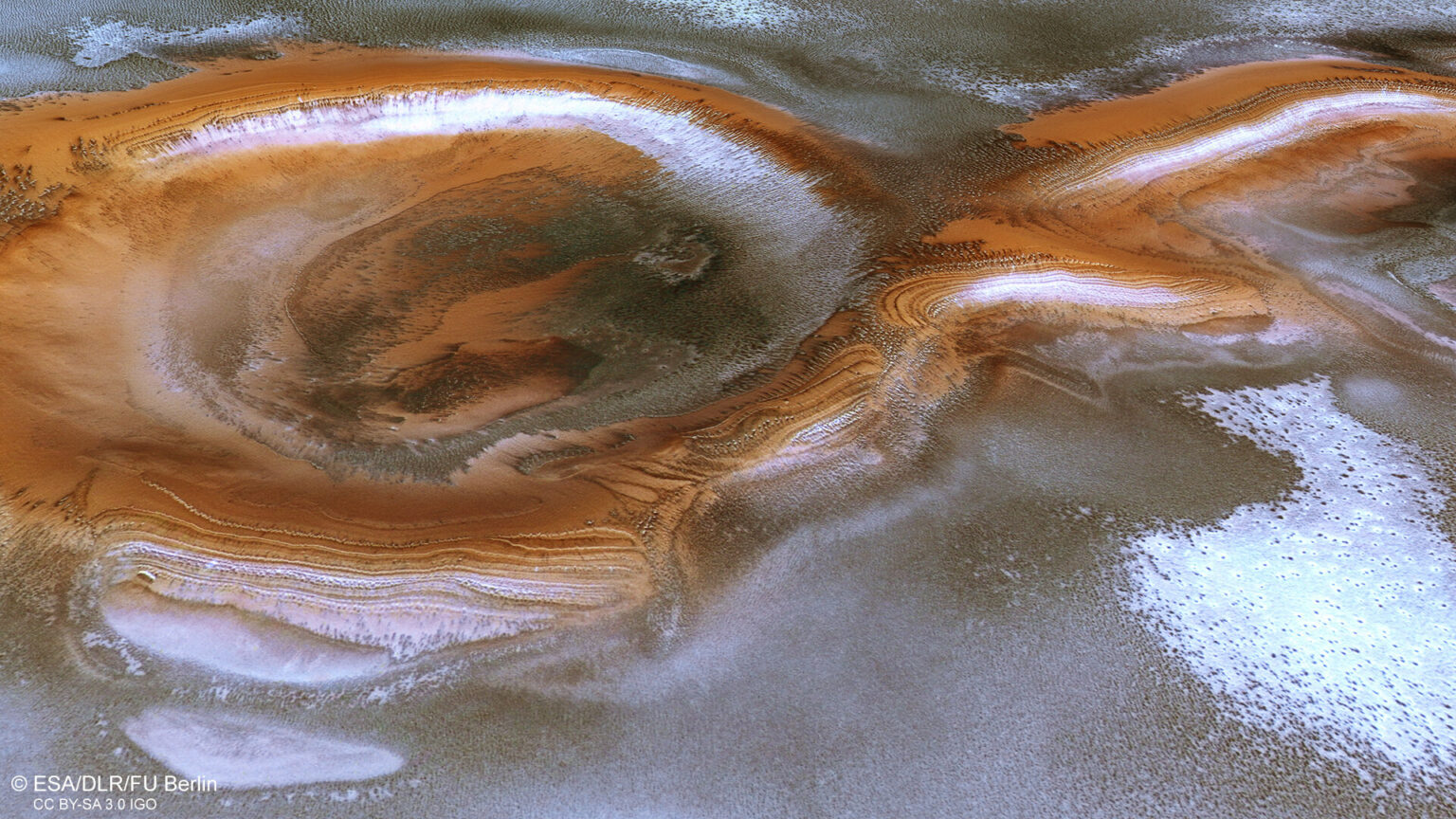 https://dev.universemagazine.com/wp-content/uploads/2022/12/perspective_view_into_icy_layered_crater_pillars.jpg