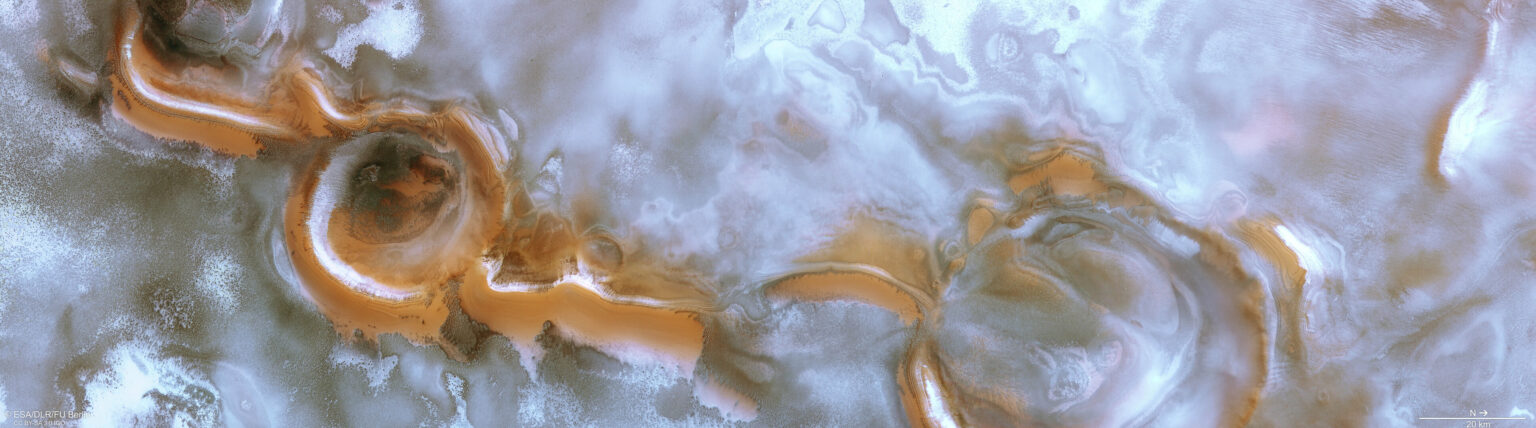 https://dev.universemagazine.com/wp-content/uploads/2022/12/swirling_craterscape_at_the_south_pole_of_mars_pillars.jpg