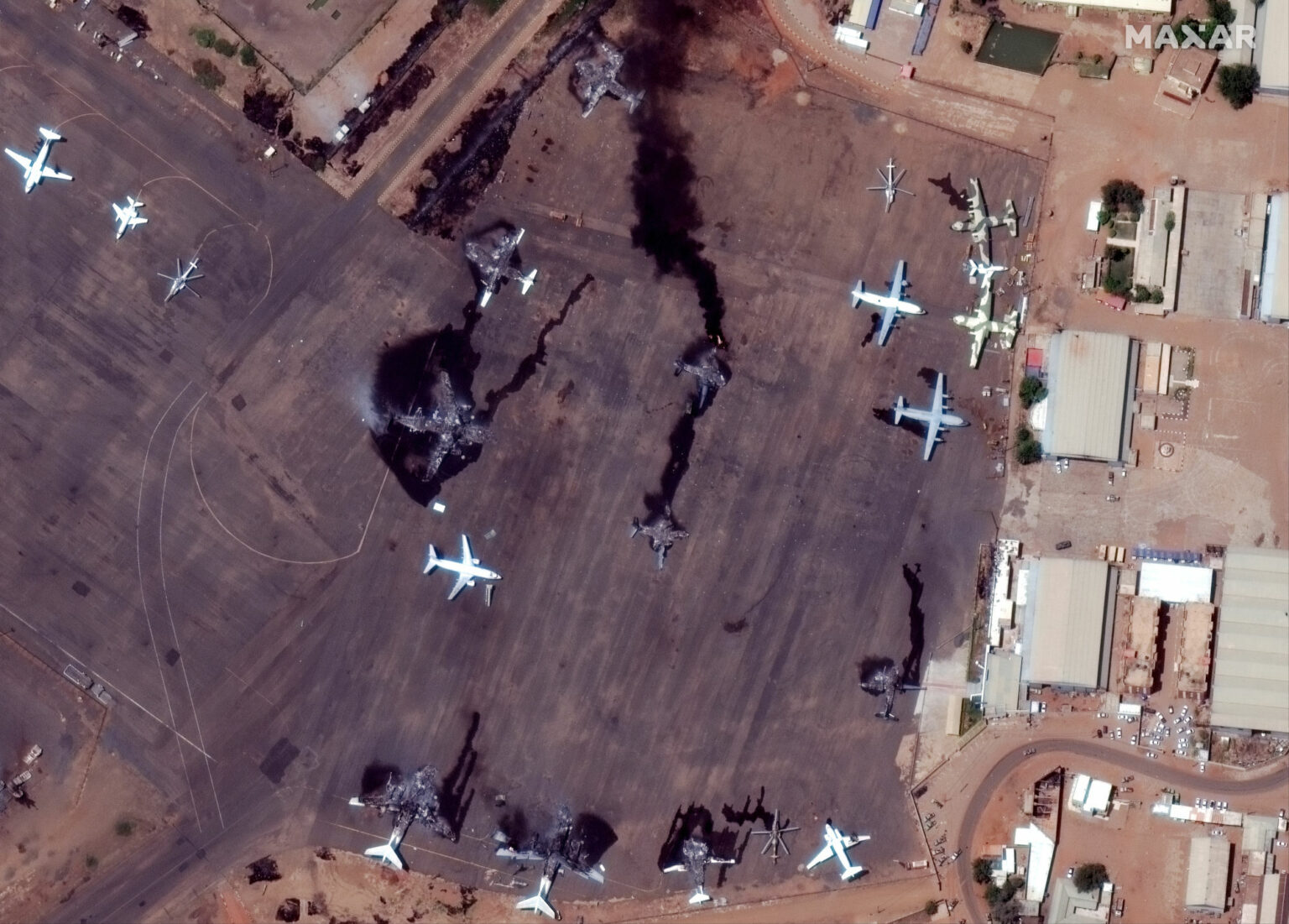 https://dev.universemagazine.com/wp-content/uploads/2023/12/02_closer-view-of-destroyed-airplanes-at-khartoum-intl-airport_sudan_17april2023_wv3-2000x1434-1.jpg