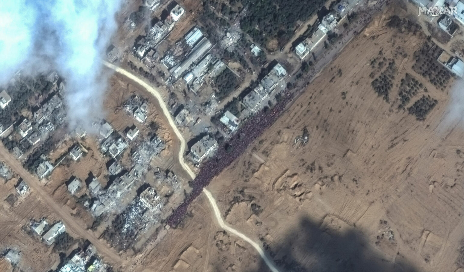 https://dev.universemagazine.com/wp-content/uploads/2023/12/13_people-waiting-to-evacuate-gaza_17nov2023_wv2-2000x1176-1.jpg